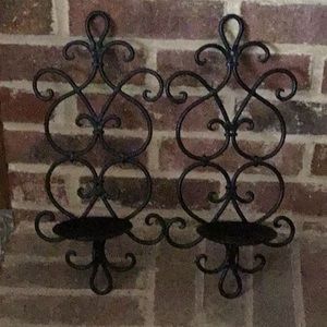 Two black iron wall sconces.